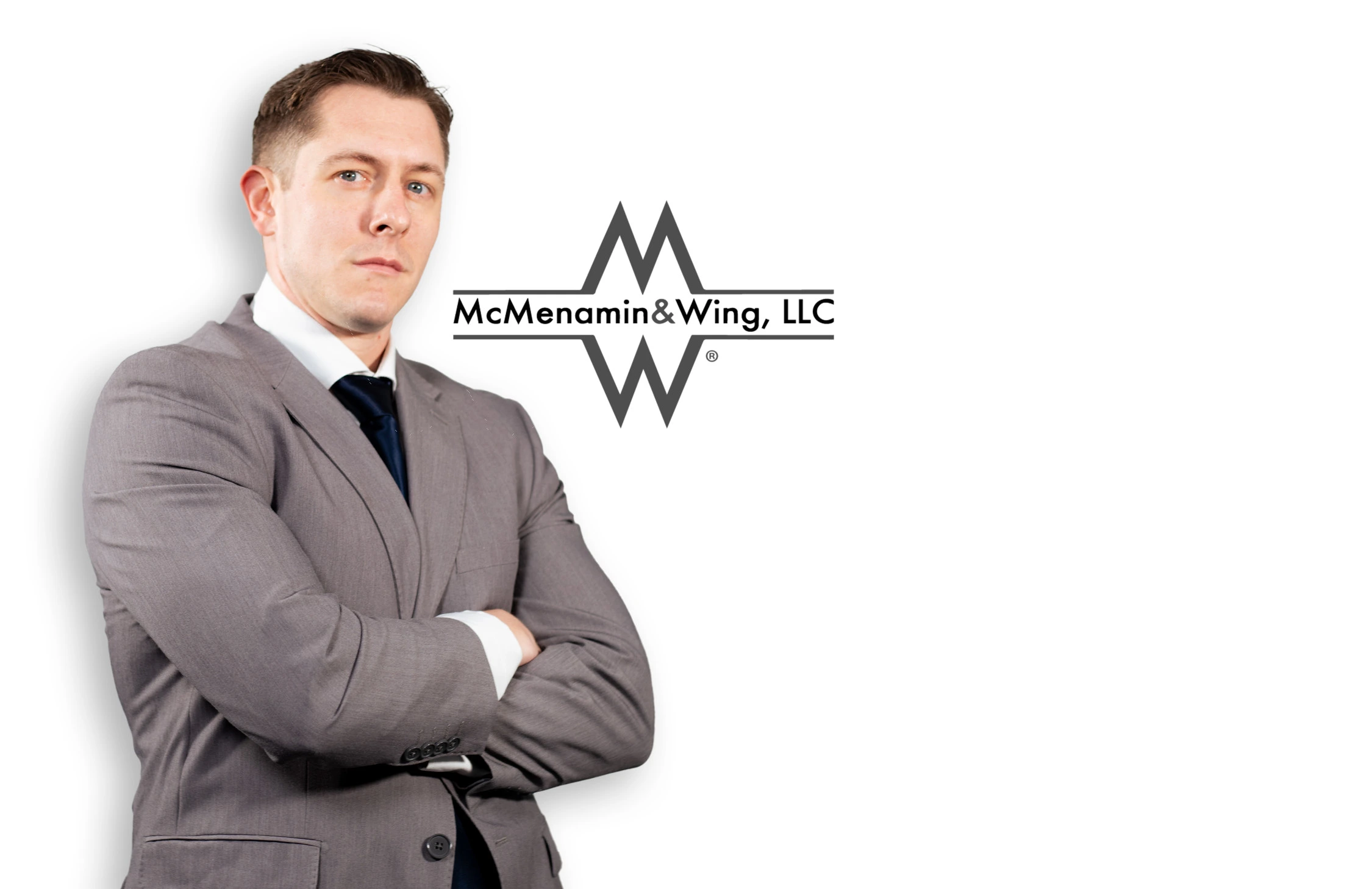 R. Wesley Zeiders Associate McMenamin & Wing LLC Headshot R. Wesley Zeiders, Associate at McMenamin & Wing, LLC, Pennsylvania workers' compensation lawyer in gray suit arms crossed
